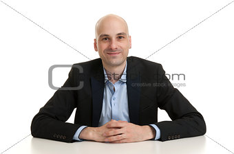 cheerful businessman sitting at a table