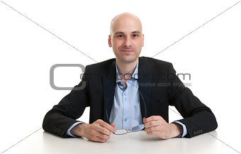 cheerful businessman sitting at a table