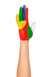 a painted hand in yellow, green, blue, red, white