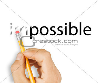 Male hand holding wooden pencil and erase letters "IM" from word