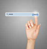 technology, searching system and internet concept - woman hand pressing Search button