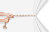 hands pulling rope on a white background