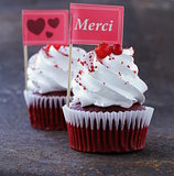 festive red velvet cupcakes with a gift compliment card