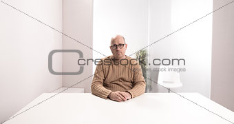 sad office worker in an empty room