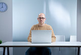 hipster nerd bald with laptop