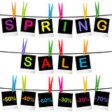 Spring sale concept with photo frames hanging on clothespins