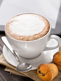 Cappuccino coffee with muffins
