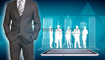 Businessman with wire-frame buildings, tablet and business silhouettes