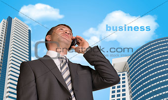 Businessman talking on the phone. Cloud with word business