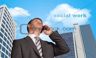 Businessman talking on the phone. Cloud with words social work