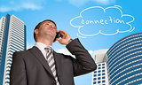 Businessman talking on the phone. Cloud with word connection