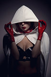 Portrait of sensual vampire girl with red lips 