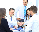 Business people shaking hands at a meeting