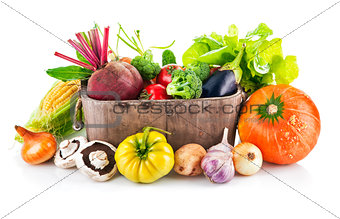 Fresh vegetables in wooden bucket with leaf lettuce