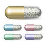 Set of medical capsule with granules on white background.