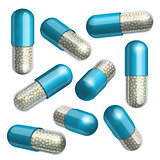 Medical blue  capsule with granules in different positions.