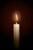 Burning candle on black background.