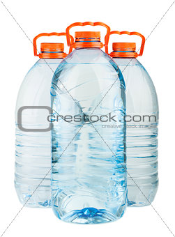 Three big full plastic water bottles with orange caps
