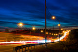 speed movement of vehicles on the highway at night illuminated