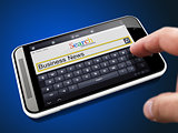 Business News Concept in Search String on Smartphone.