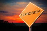 Terrorism Inscription on Warning Road Sign.
