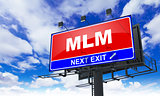 MLM Inscription on Red Billboard.