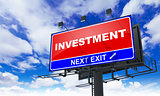 Investment Inscription on Red Billboard.