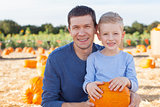 family at pumpkin patch