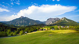 A beautiful view of the austrian alps with typical mountain hous