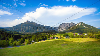 A beautiful view of the austrian alps with typical mountain hous