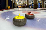 Curling stones on an indoor rink