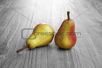 two colorful pears