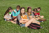 Six Teens Studying Outdoors