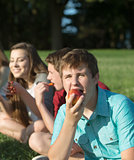 Hungry Teen Eating Apple