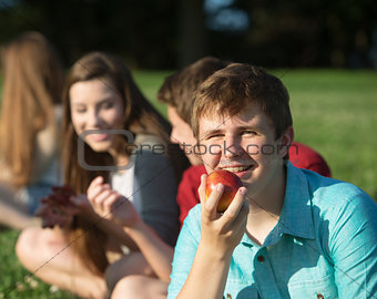 Happy Teen Eating Fruit