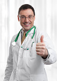 friendly doctor smiling giving thumbs up