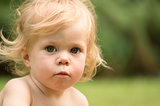 Outdoor portrait of the girl of 1 year old.