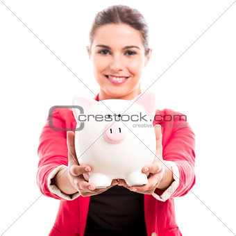 Business woman with a piggy bank
