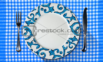 Empty Plate on Tablecloth with Cutlery