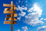 Wooden Sign on Blue Sky with Clouds