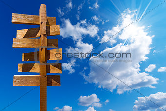 Wooden Sign on Blue Sky with Clouds