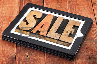sale word on digital tablet