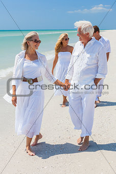 Four People Two Senior Family Couple Walking Tropical Beach