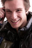 smiling young man on the phone
