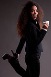beautiful afroamerican girl with coffee in a strange pose