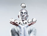 Magician with Glass Balls in Stage Makeup and Costume