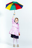 Cute little girl with colorful umbrella
