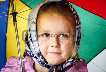 Cute little girl with colorful umbrella