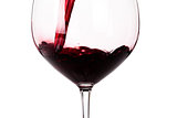 Glass of red wine closeup isolated on white