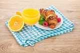 Orange juice and fresh croissant